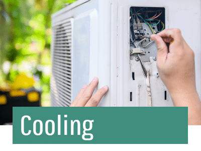 HVAC technician using tools to fix air conditioner.